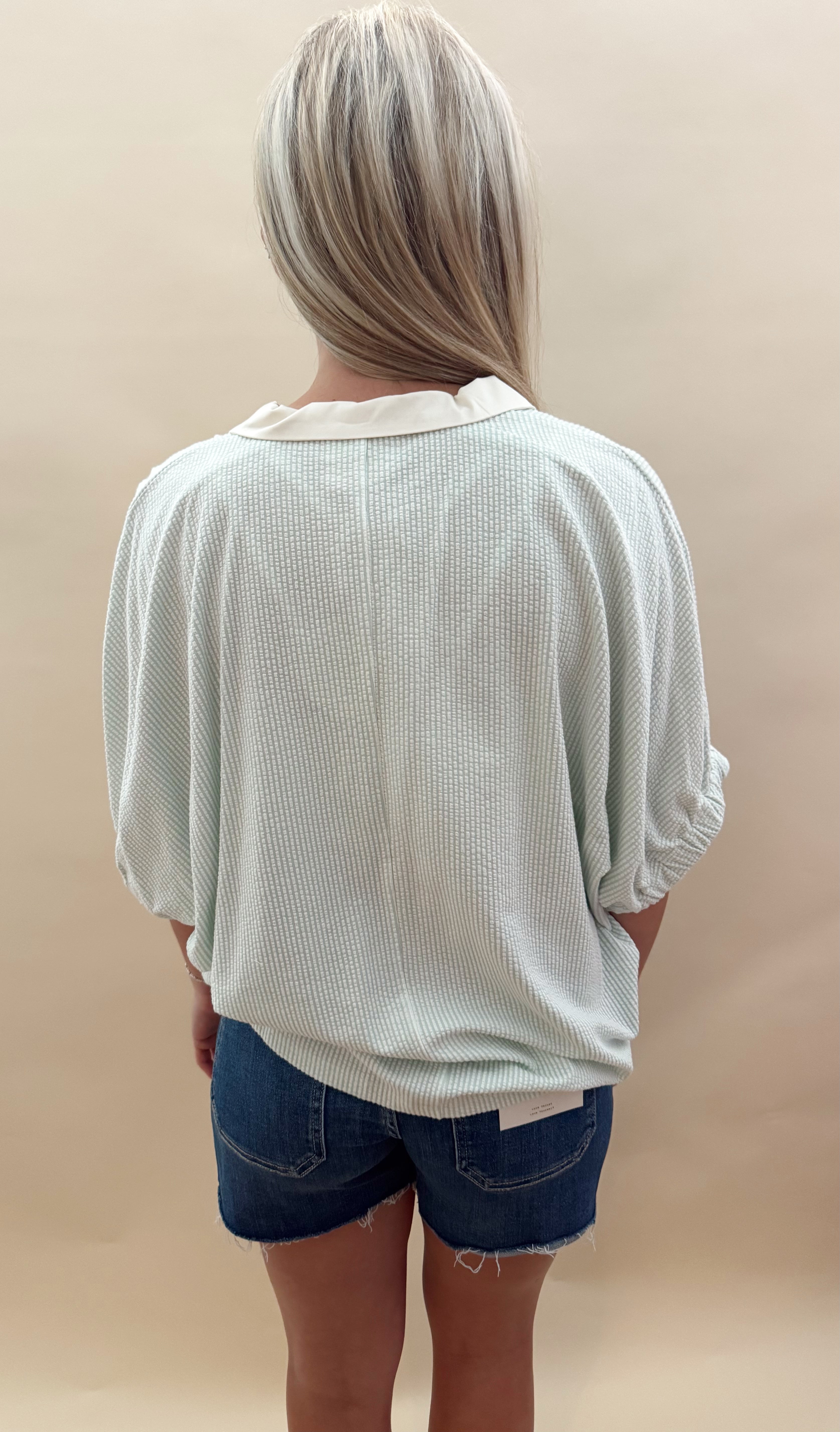 Green and white striped top