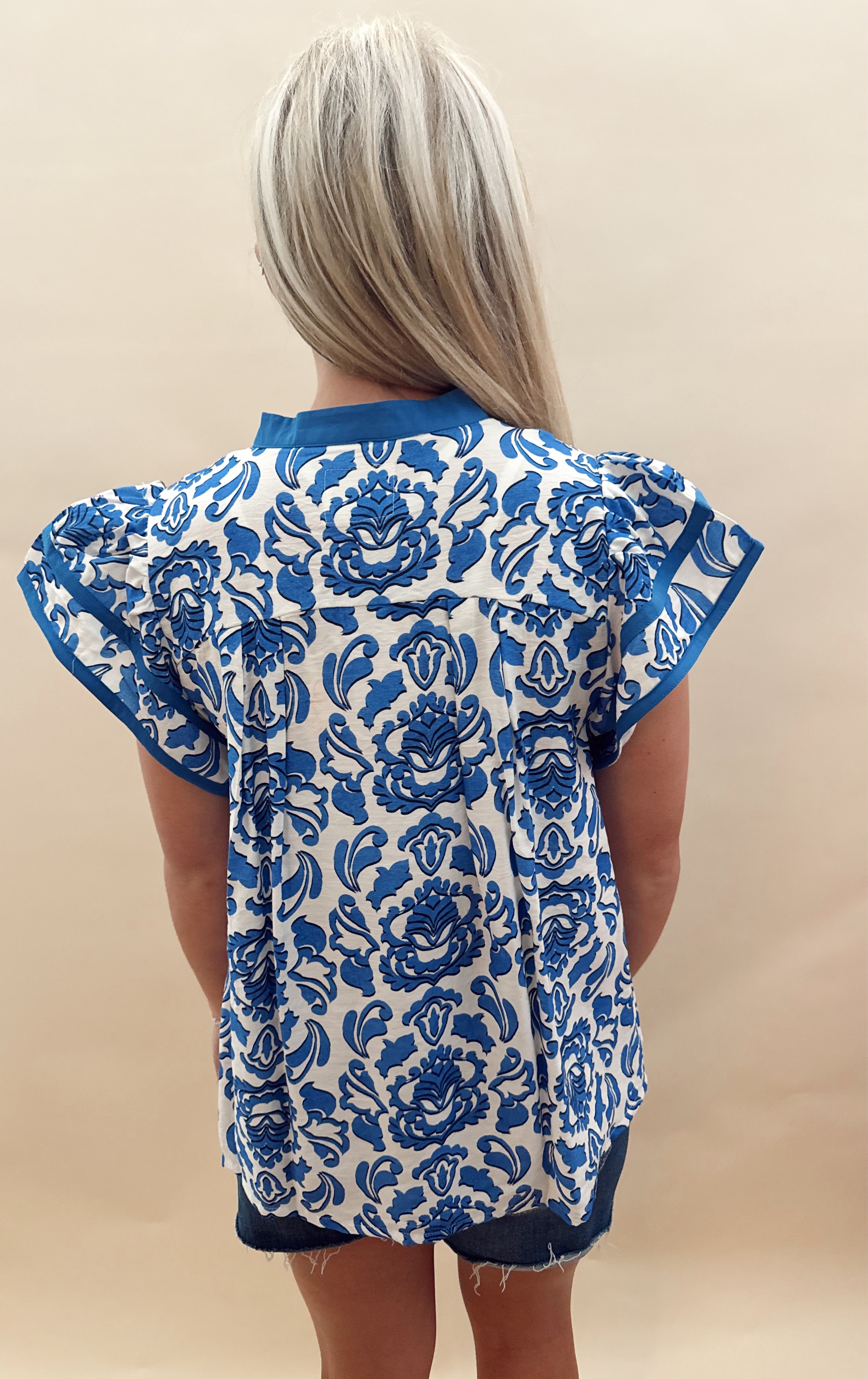 Blue and white patterned top