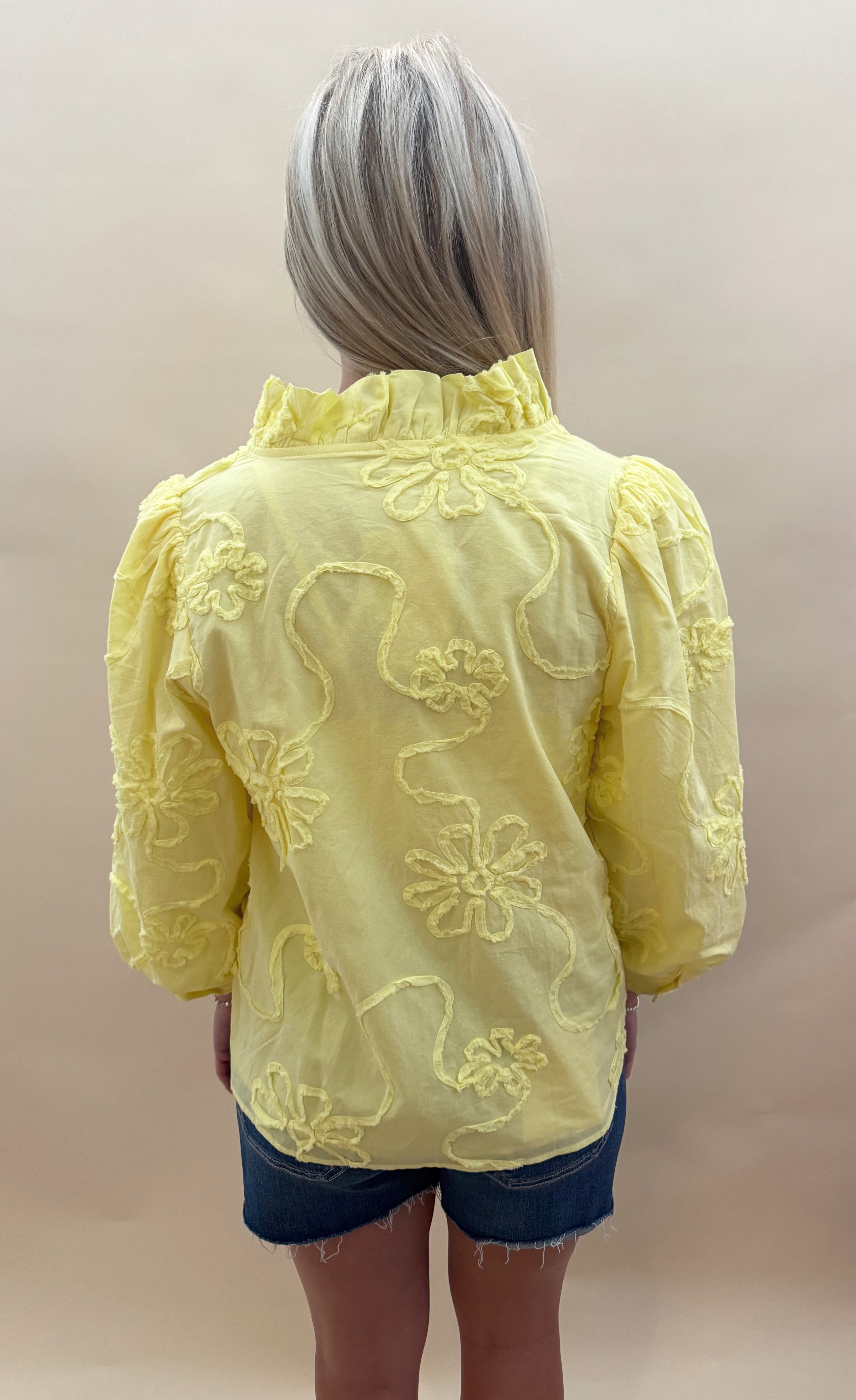Yellow button up top with floral detail