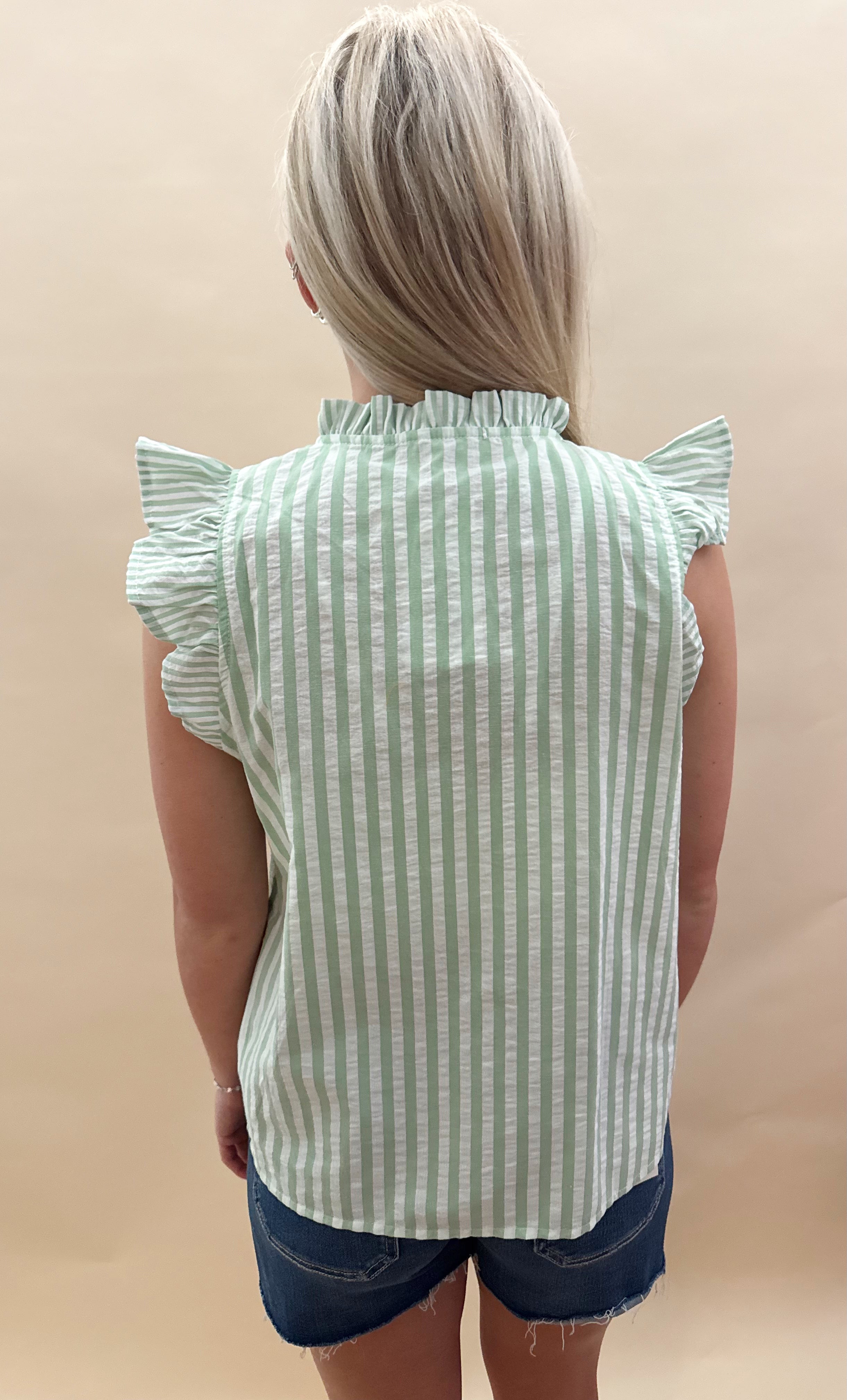 Green and white striped top