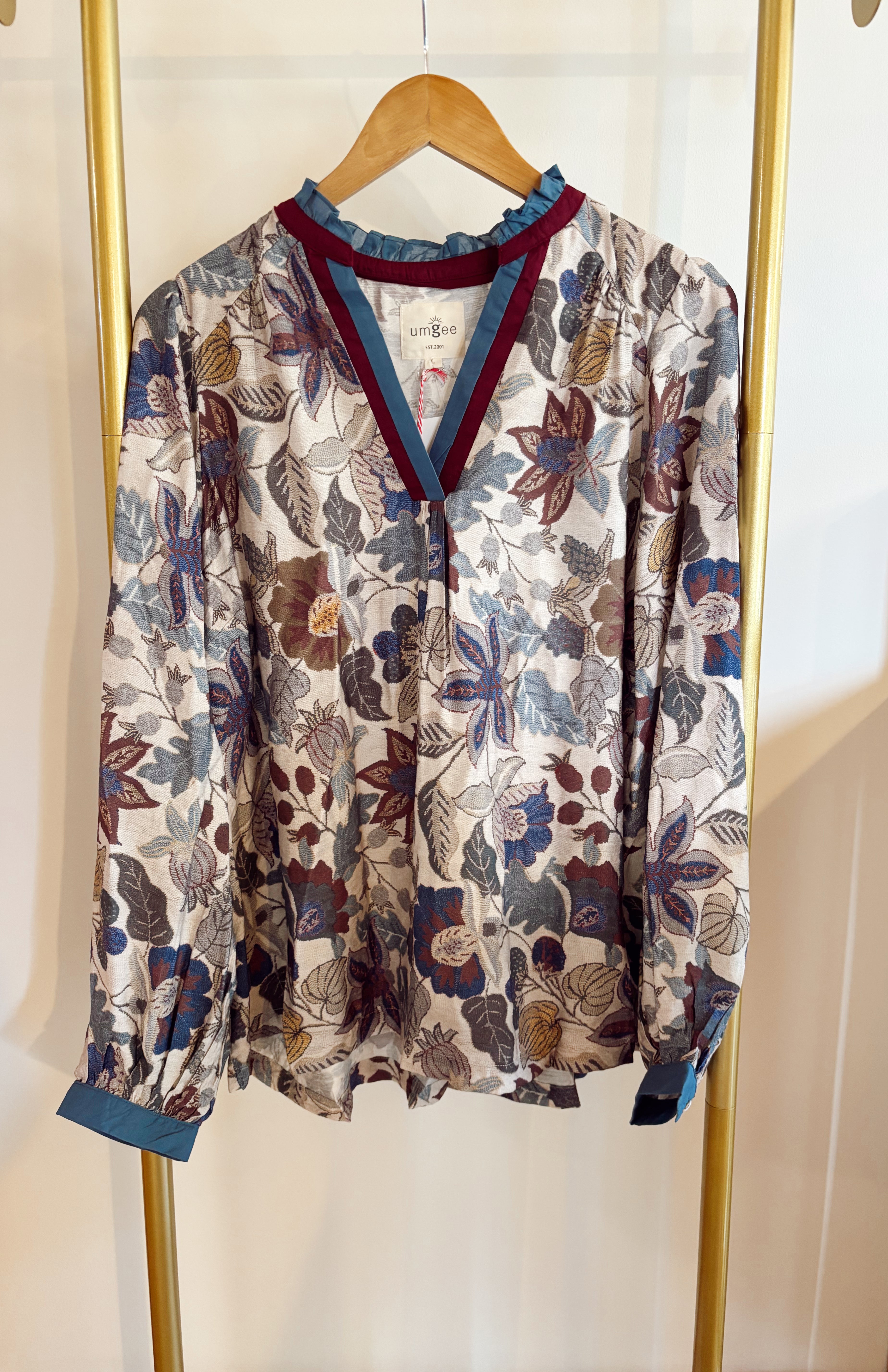 Floral print top with color block contrast