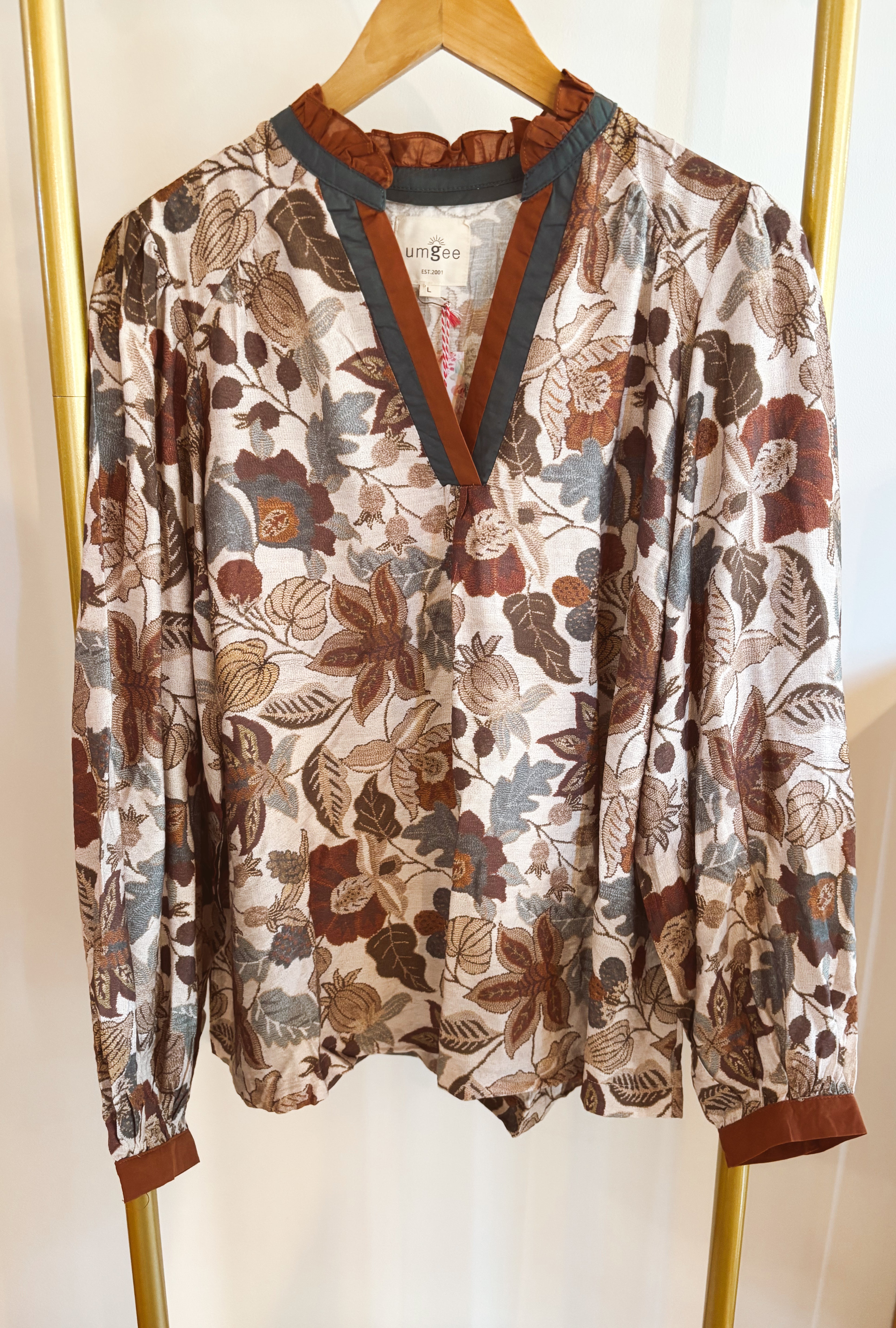 Floral print top with color block contrast