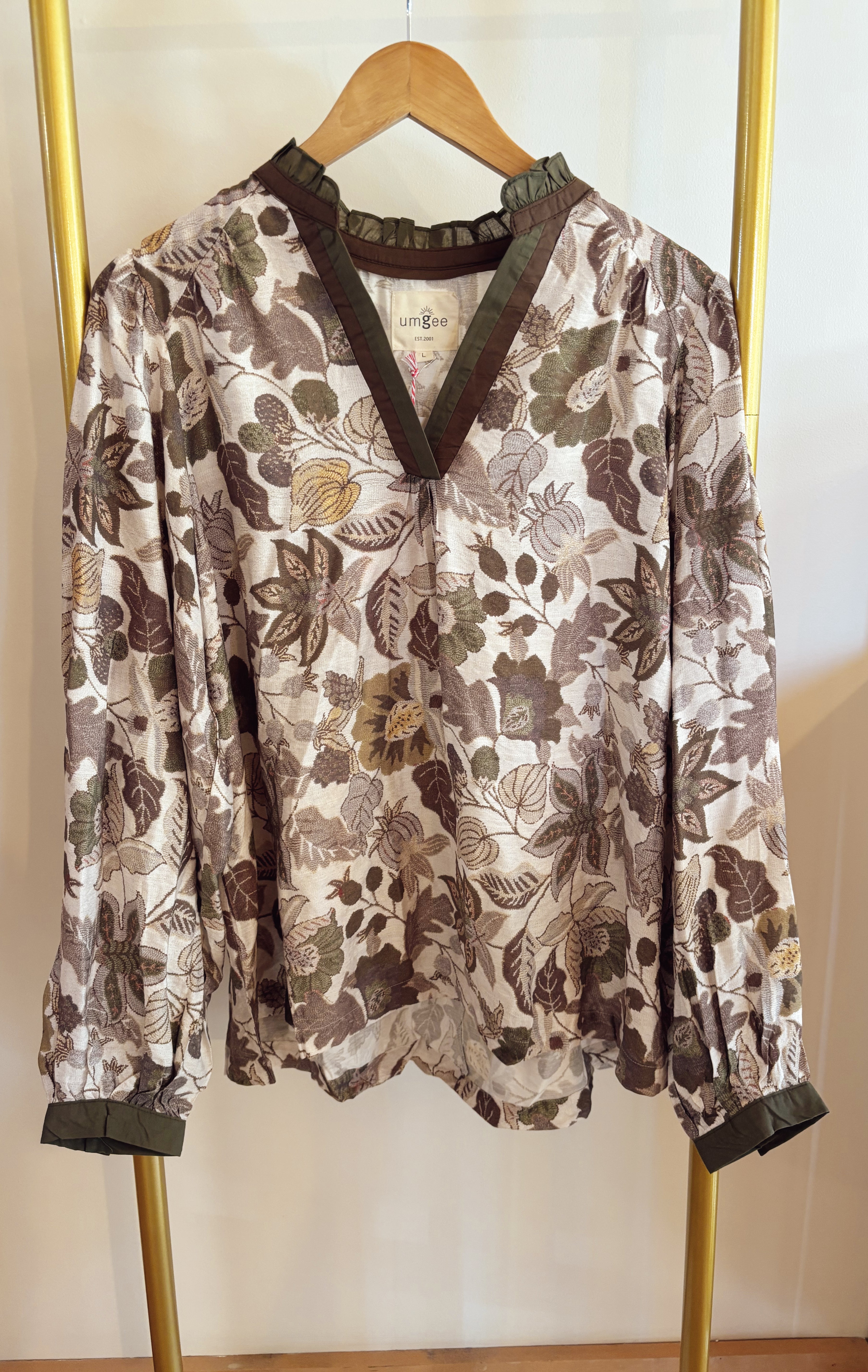 Floral print top with color block contrast